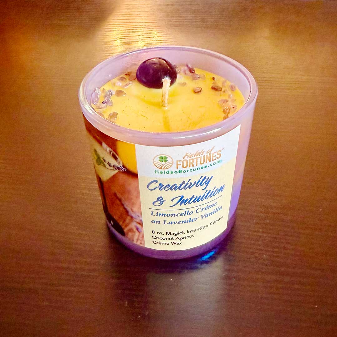 8 oz. Limoncello and Lavender  Vanilla  Intention Candle.  Two-layered candle in a iridescent container on a wooden surface. Large amethyst stone with sprinkles of amethyst. 