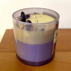 Limoncello and Lavender - Two-layered candle in a iridescent container on a wooden surface. Large lavender stones.