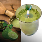 Green candle in a glass container with matcha powder, green leaves, and a bamboo whisk on a wooden surface. Aventurine heart with Peridot sprinkles.