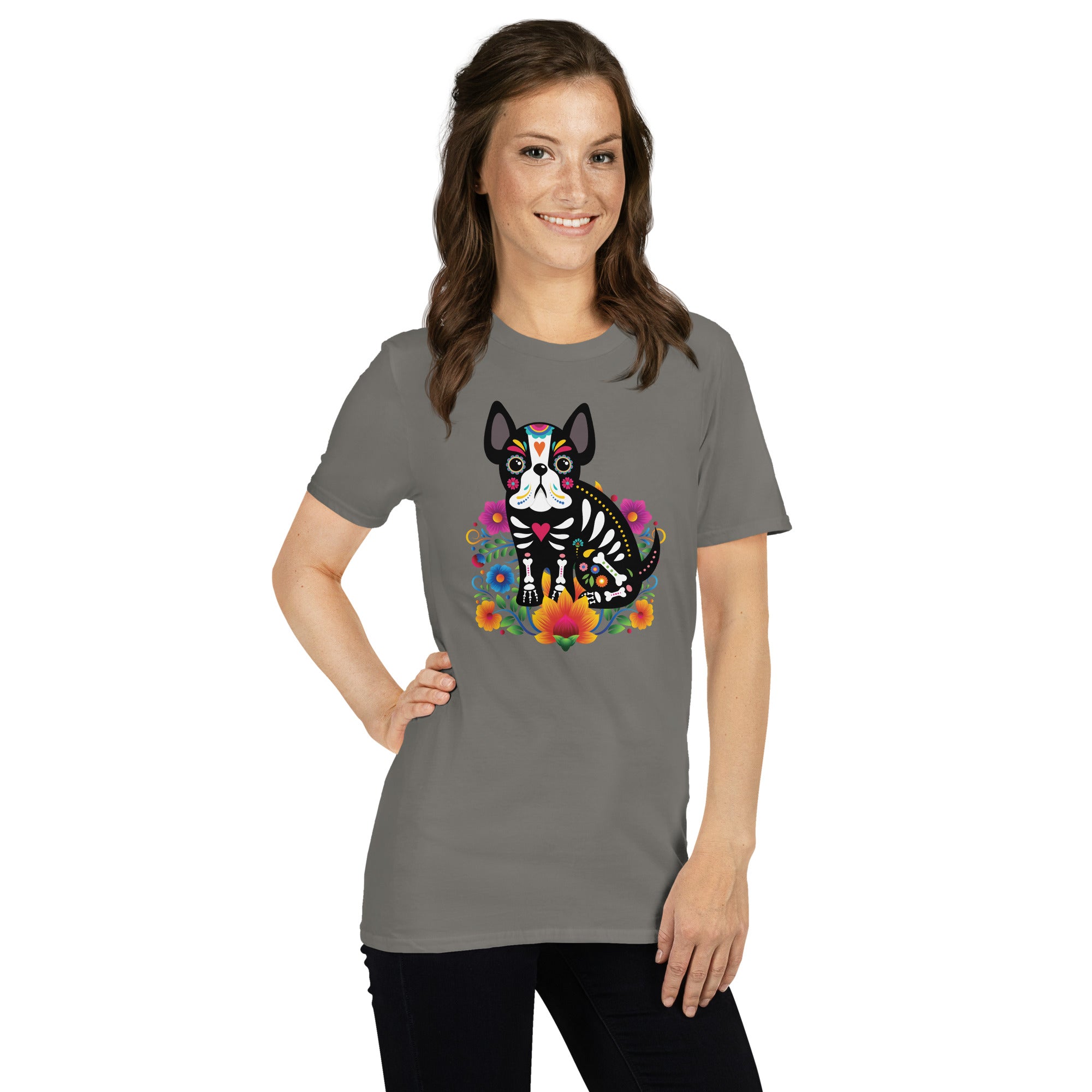 Woman wearing a charcoal gray  t-shirt with a colorful dia de los meurtos dog design.