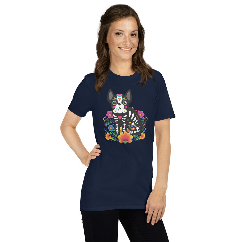 Woman wearing a navy t-shirt with a colorful dia de los meurtos dog design.