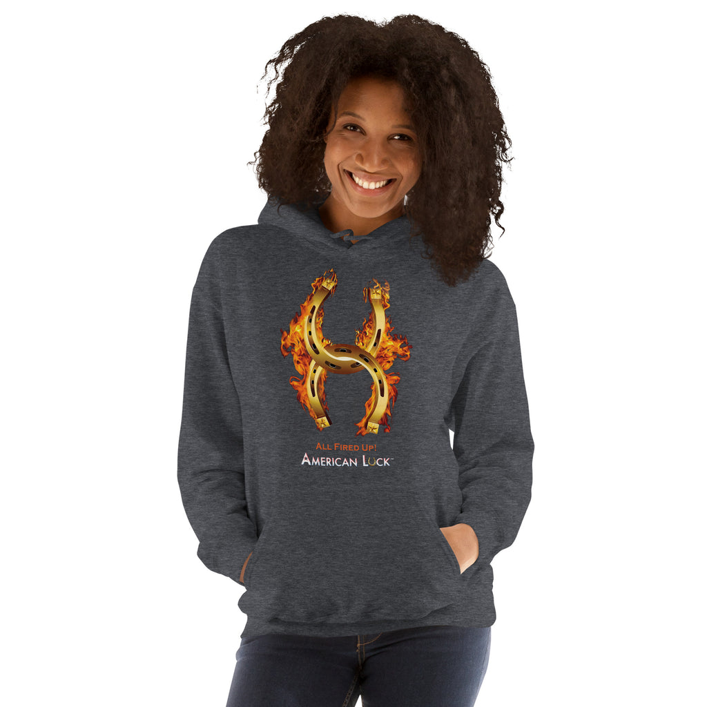 Person wearing a  dark heather hoodie with a fiery golden horseshoe  design, All Fired Up! American Luck.