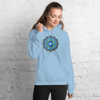 Woman wearing a light blue hoodie with a colorful flower of life mandala design .