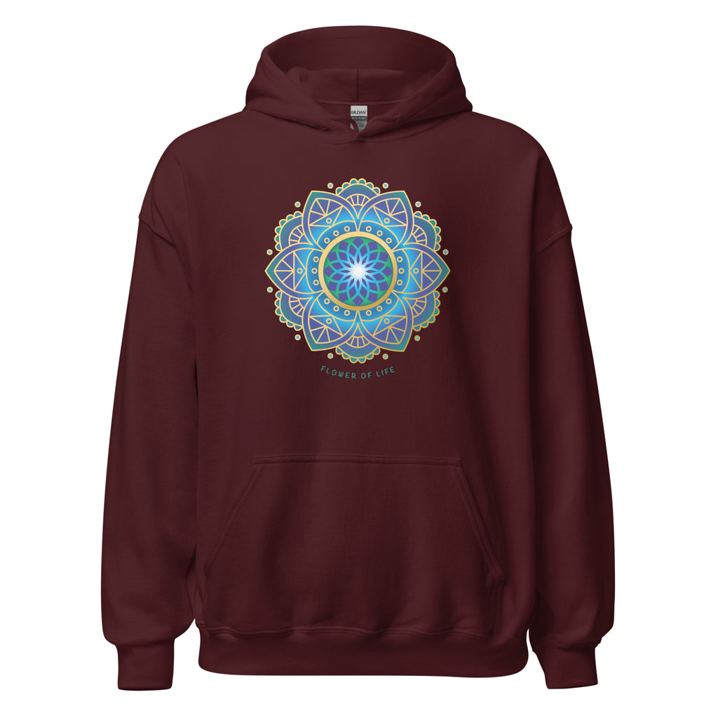 Woman wearing a maroon hoodie with a colorful flower of life mandala design .