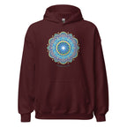 Woman wearing a maroon hoodie with a colorful flower of life mandala design .