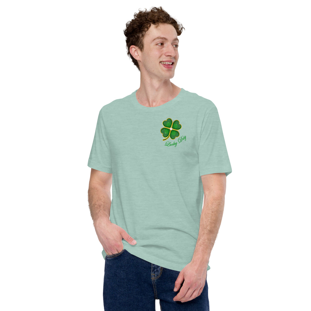 Person wearing a heather dusty green  t-shirt with a four-leaf clover design with Lucky Day script.