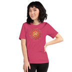 Woman wearing a raspberry tee, with a colorful red and gold Chinese prosperity design .