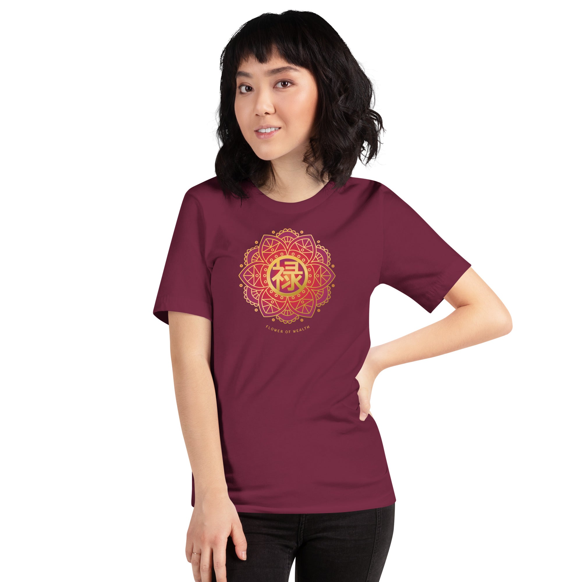 Woman wearing a maroon tee with a colorful red and gold Chinese prosperity design .