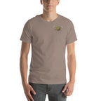 Person wearing a tan t-shirt small gold Viking Spirit design.
